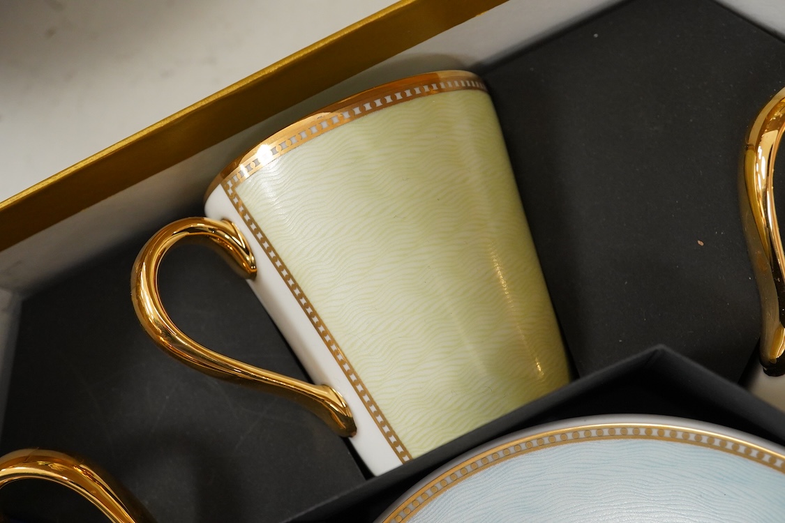 A Royal Collection of Faberge set of six bone china cups and saucers, boxed